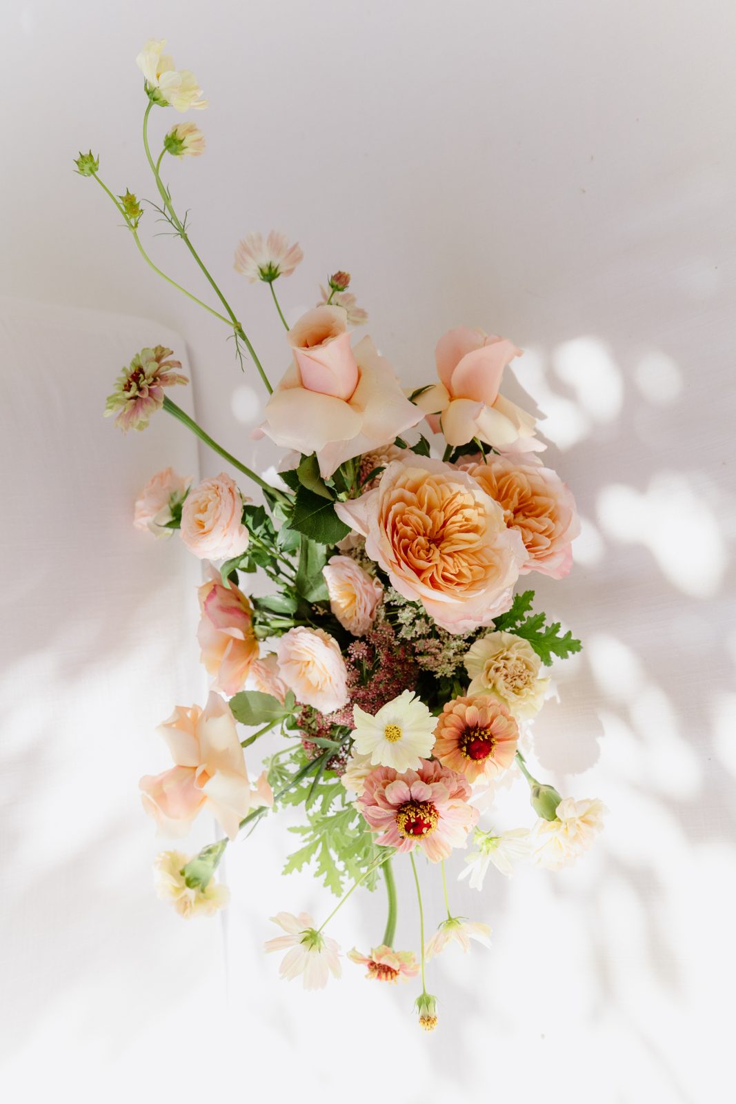 Peach and cream floral bouquet in soft light